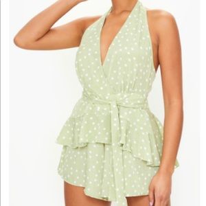 Sage green polka dot halter romper with belter waist.